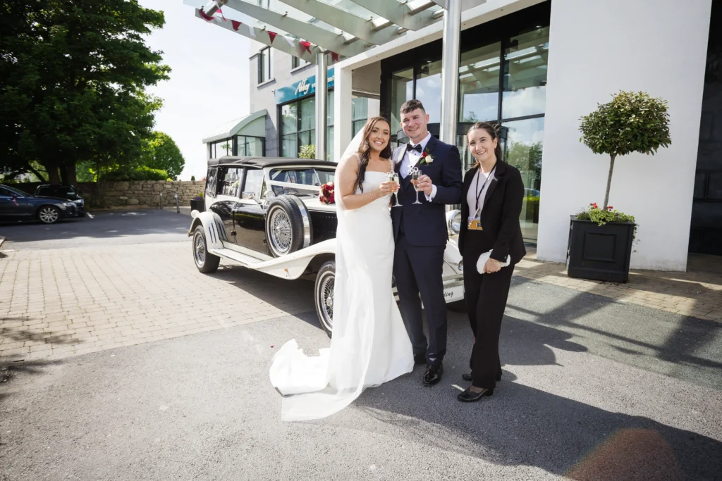 Bride and groom arriving at the Loughrea Hotel and Spa wedding reception