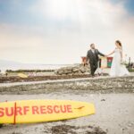 Newlyweds walking beside the beach on Salthill Promenade