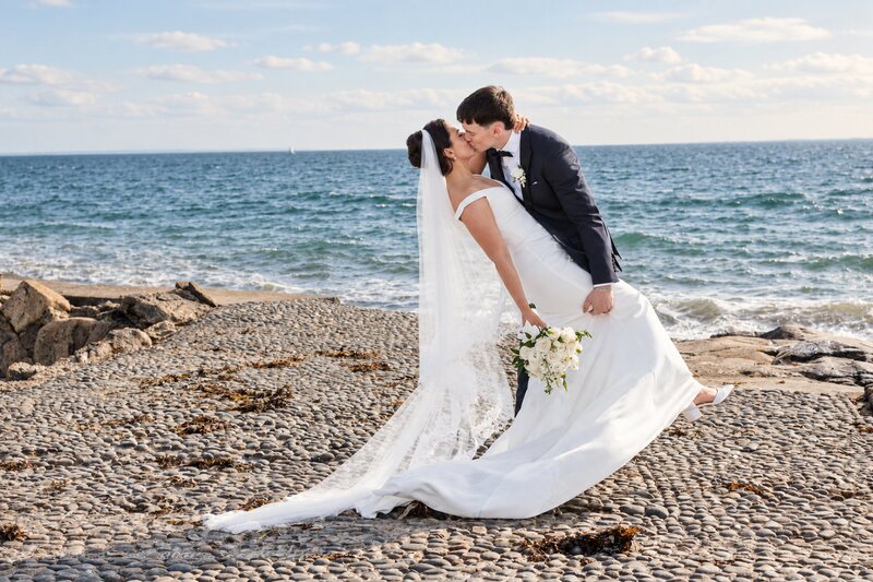 husband dip kissing wife in salthill